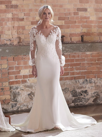 3-D floral lace sheath wedding dress with a dreamy illusion overskirt By Sottero and Midgley Opt for all the sleeve and accessory changeups in this 3-D floral lace sheath wedding dress—just to keep everyone on their toes for your best (and most fashionable) day ever. Color: Ivory